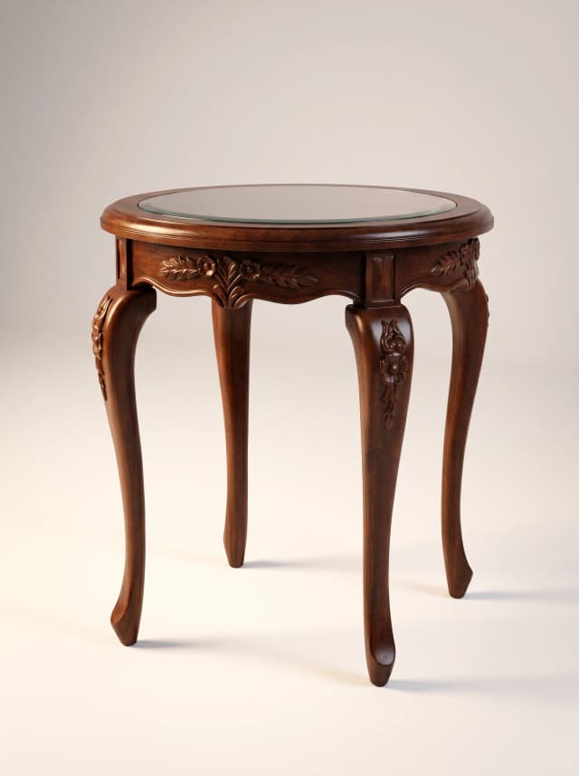 Elegant curved teak wood side table with carved floral detail.