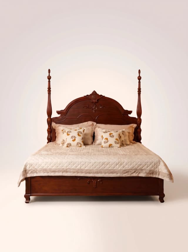 Elegant Victorian poster bed crafted from teak wood.
