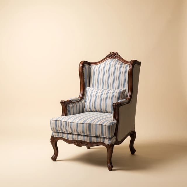 Victorian-style Regal Crest Wingchair in rich teak wood.