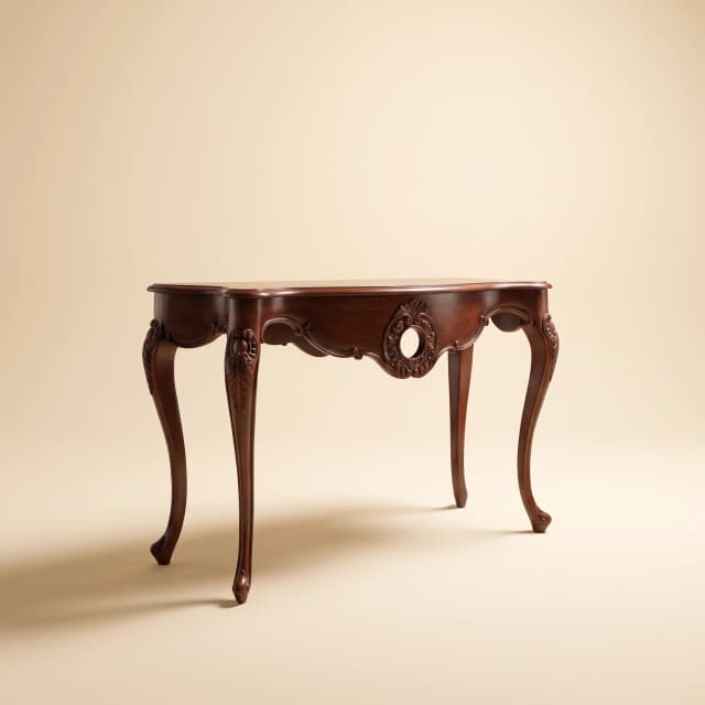 A photo of The Heritage Console, a Victorian-style teak wood console table featuring intricate designs.